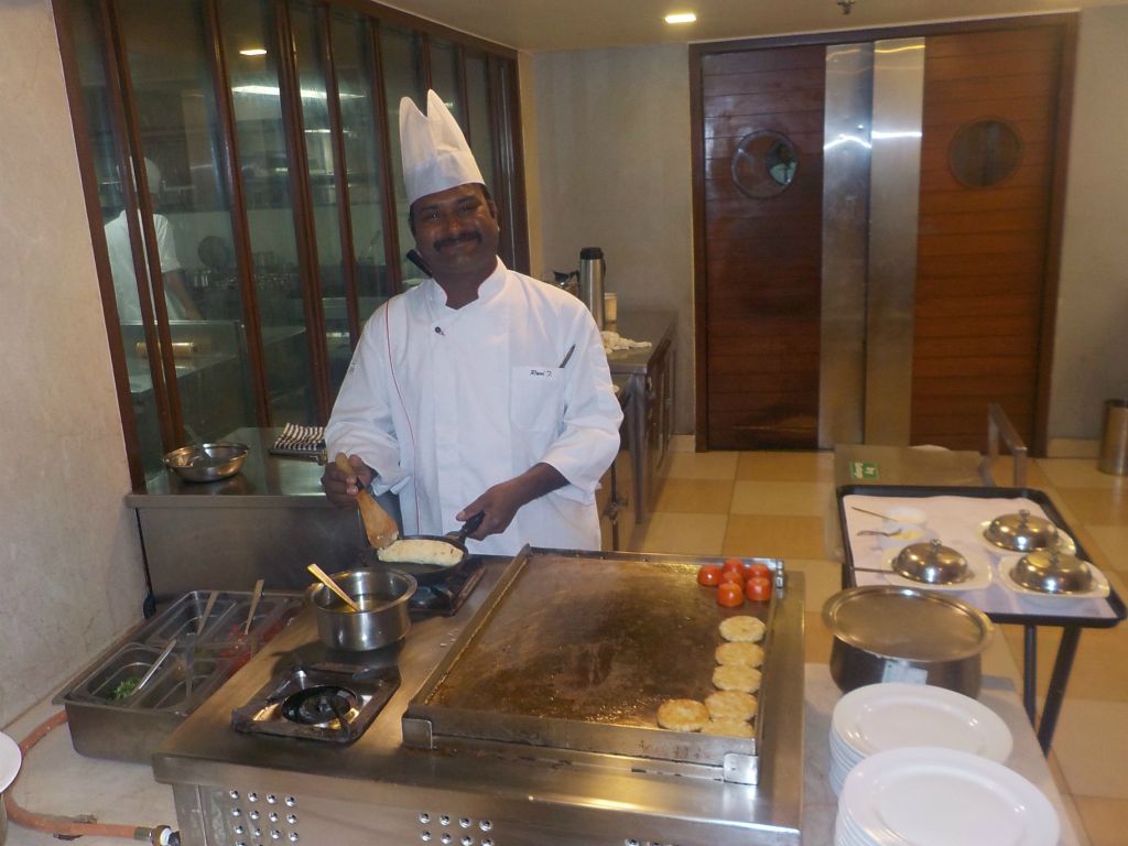And here you are: hotel's restaurant and a happy cook. He is preparing an never-ending omlet :-)