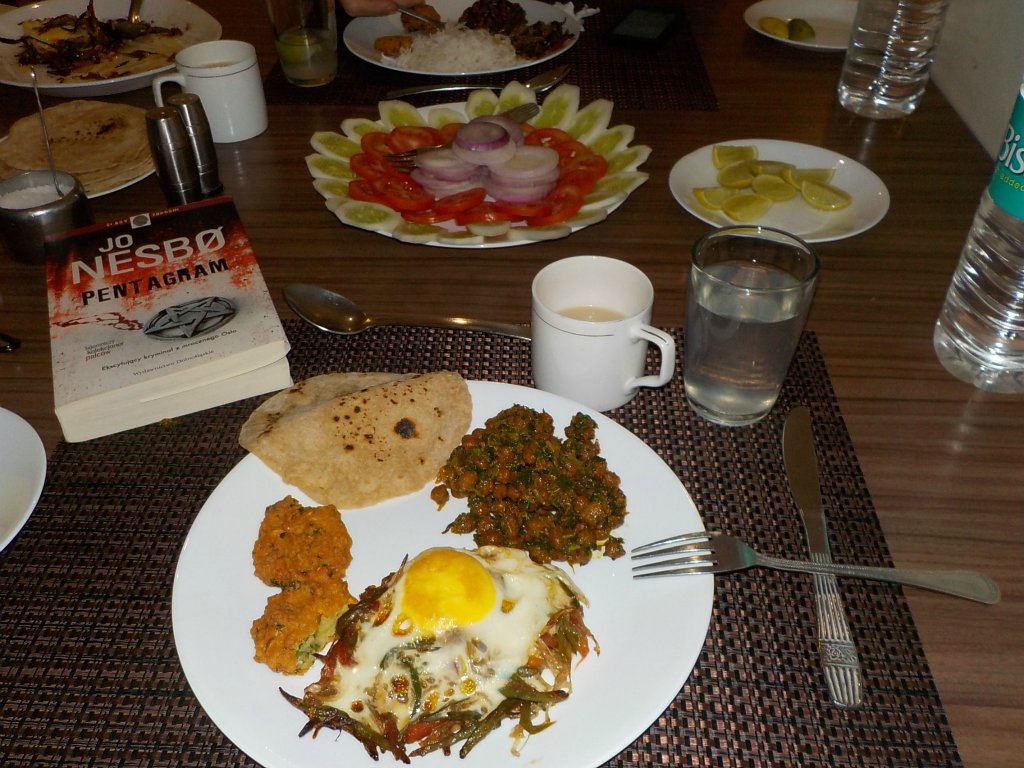 A supper in the guest house. That fried egg on the vegetables is delicious. A world master class. Unfortunately I have no idea how to prepare it at home
